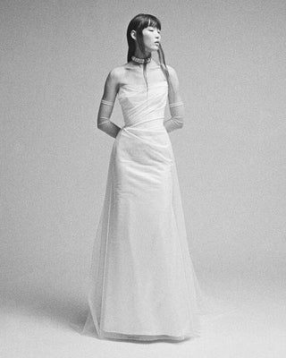 Vivienne Westwood couture Nova Rhea wedding dress in luxurious Naia satin with recycled tulle, showcasing British craftsmanship and sustainable design.