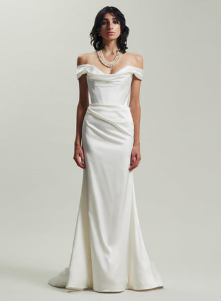 Front view of the Nova Cora gown by Vivienne Westwood in ivory stretch satin, featuring a corset bodice and asymmetrical train.