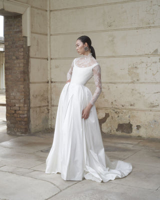 Vivienne Westwood Grand Camille bridal gown in sustainable Naia satin, showcasing couture craftsmanship and iconic corset design.