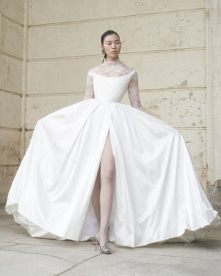 Vivienne Westwood bespoke bridal gown blending artisanal detailing, eco-conscious materials, and British couture heritage.