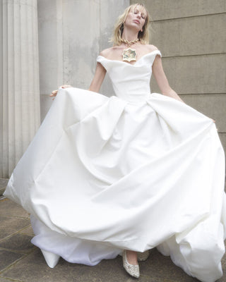 Model posing in the Nova Bagatelle gown, exuding timeless elegance and sophistication.