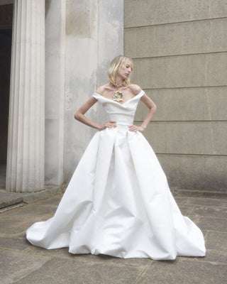 Full front view of the Nova Bagatelle gown, featuring the elegant silhouette and romantic draped neckline.