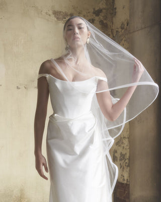 Vivienne Westwood bridal gown in Naia stretch satin, showcasing signature corset-inspired details and timeless couture tailoring.