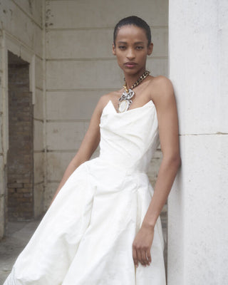 Close-up of the Victoria gown, focusing on the intricate topstitching detail of the corset and the luxurious fabric that exudes sophistication.