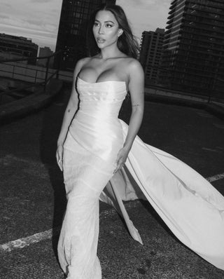 Luxurious top crafted in mikado, featuring a structured silhouette and elegantly draped strapless neckline.