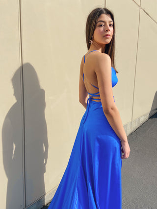 Elegant maxi gown with adjustable straps, plunging neckline, and high slits, perfect for special occasions and formal events.