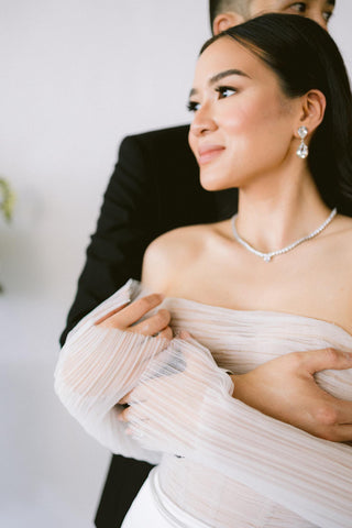 Elegant sleeveless evening gown featuring a flattering sheath silhouette and back slit.