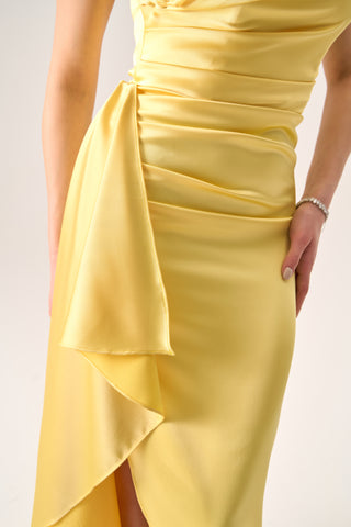 Elegant evening dress with a sleek, flattering silhouette and eye-catching draped details.