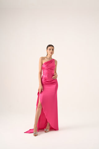 Cascading side sash adds refined glamour to this elegant evening gown.