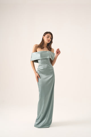 Front view of the Amelia gown on a model, emphasizing the elegant off-the-shoulder neckline and smooth, body-hugging silhouette.