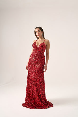 Form-fitting gown adorned with sequins, showcasing a deep neckline and dramatic low back, perfect for formal or black-tie events.
