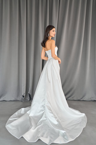 Minimalist bridal dress with a seamless sheath style and luxurious satin finish