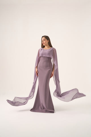 Floor-length column gown with timeless boat neckline and dramatic cape sleeves, perfect for formal evening events