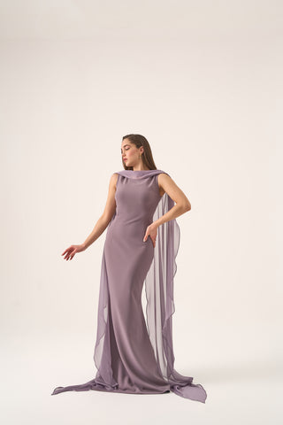 Elegant evening gown featuring flowing cape sleeves and a graceful boat neckline, embodying luxury and sophistication