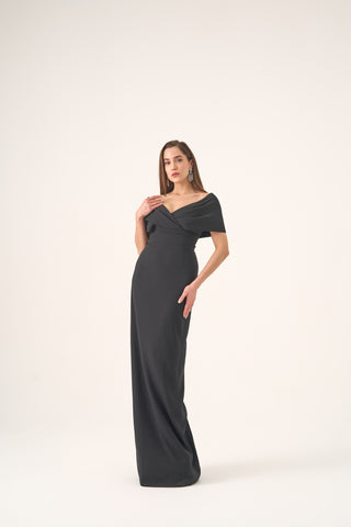 Luxurious evening gown featuring a tailored column silhouette, wrap neckline design, and elegant off-shoulder sleeves.