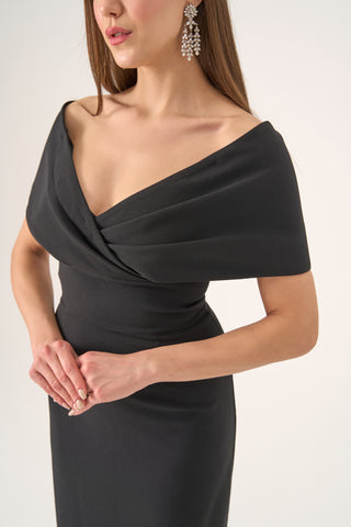 Sophisticated off-shoulder column gown with a draped Bardot neckline and smooth crepe fabric, ideal for formal evenings.