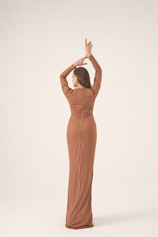 Luxury jersey gown with a flattering column silhouette, V-neckline, and elegant long sleeves, ideal for black-tie occasions.