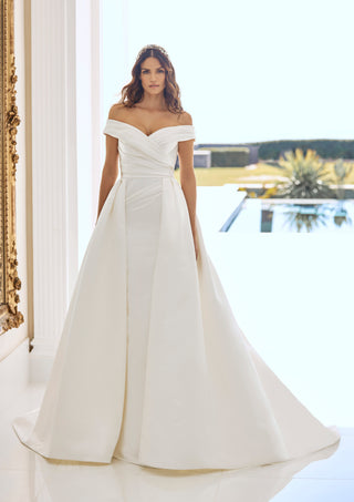 Front view of Dimitra gown by Pronovias with draped bodice and overskirt.