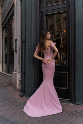 Back view of Lydia Matte Crepe Gown by Nadia's, showcasing the elegant chapel-length train and off-the-shoulder design.