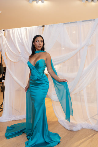 Sophisticated strapless mermaid gown with a draped bodice and flowing train for an elegant evening look