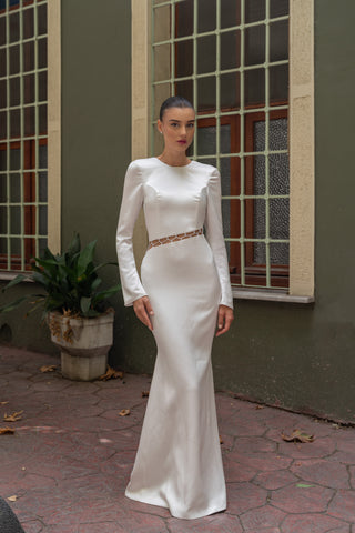 Elegant column silhouette wedding dress with a structured crew neckline and graceful long sleeves for a modern bridal style.