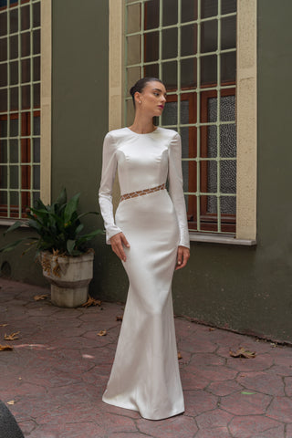 Sophisticated column bridal gown with a structured crew neckline and tailored long sleeves, exuding timeless elegance.