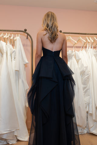 Refined formal gown featuring a strapless fitted bodice, seamless back zipper.