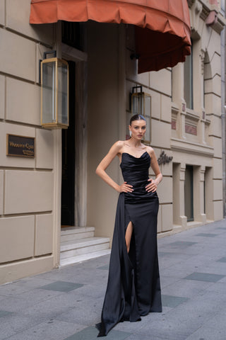Flattering cowl neckline and thigh-high slit for a dramatic evening look