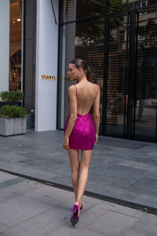 Elegant sheath dress adorned with intricate sequin details and a sleek mini cut