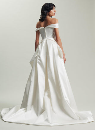 Back view of the Diva Train by Vivienne Westwood in Naia Heavy Stretch Satin, baroque-inspired design wrapping around the waist, adding volume and drama to a bridal gown.