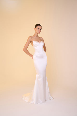 Bridal satin gown with sweetheart neckline, figure-hugging drop waist, and flared mermaid skirt for an elegant wedding look