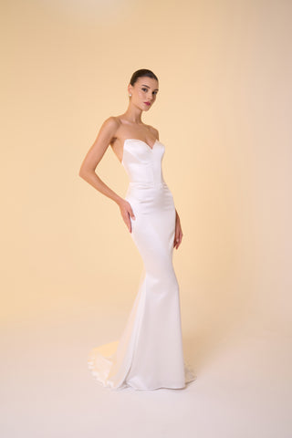 Sophisticated mermaid gown with a floor-length hem, sleeveless design, and drop waist silhouette perfect for luxury weddings
