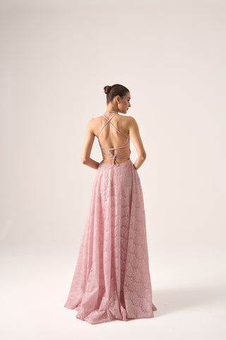 Back view of model in Erina lace gown by Nadia's, showcasing delicate lace details and flowing train