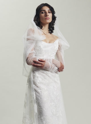 The intricate lace details of the Vivienne Westwood fichu blouse, creating a sophisticated and regal bridal look.