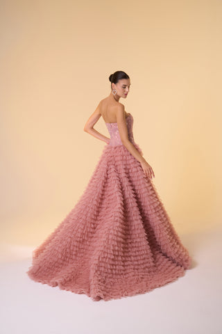 Maxi ball gown with dramatic ruffled tulle skirt and strapless neckline, perfect for black-tie and special events.
