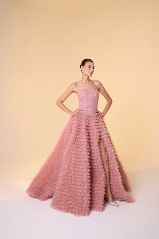 Dramatic evening dress with voluminous layered tulle skirt and romantic floral embellishments for formal wear.