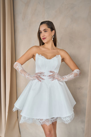 Sophisticated mini evening dress featuring a sweetheart neckline, sleeveless design, and romantic lace detailing.