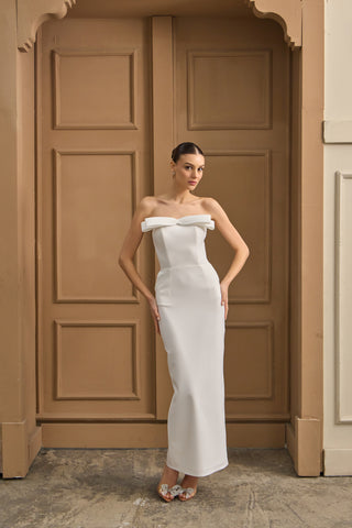 Modern bridal midi dress with a sleek silhouette and sculpted neckline, ideal for fashion-forward wedding celebrations.