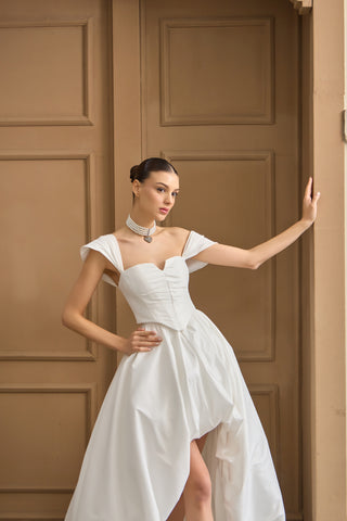 Sophisticated bridal corset with a straight neckline, elegant draped sleeves, and a figure-enhancing structured silhouette.