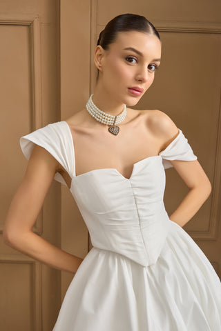 Elegant taffeta corset topper with a structured bodice, straight neckline, and off-the-shoulder sleeves for a romantic bridal look.