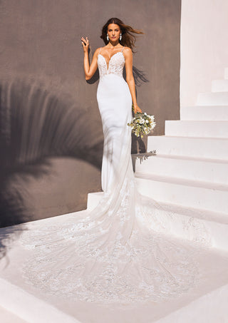 Izara gown by Pronovias featuring a sleek lace bodice and crepe skirt.