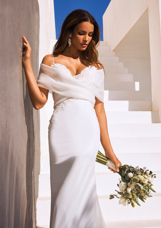 Mermaid bridal dress with lace embroidery on waist and hips.