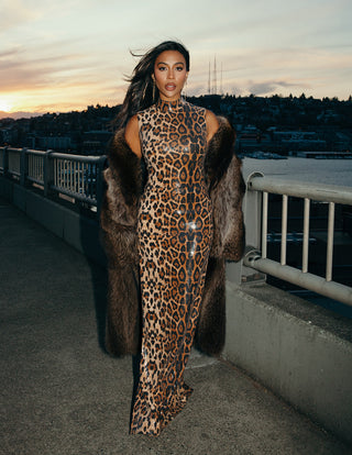 Sophisticated sequined evening gown with a sleek column silhouette and shimmering beaded embellishments