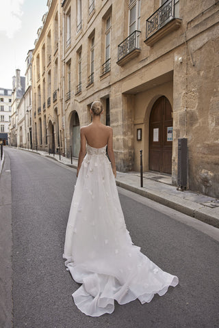Back view of the Joan gown highlighting the flow of silk organza and the elegant back zipper closure.