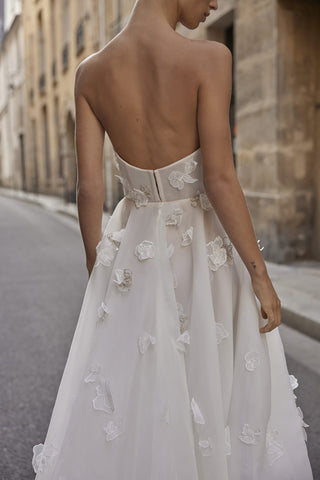 Close-up of the Joan gown’s corset bodice showcasing intricate pearl, crystal, and floral appliqué embroidery.