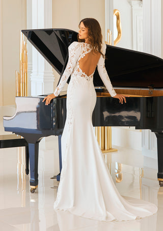 Kaya bridal gown featuring open back and intricate lace detail.
