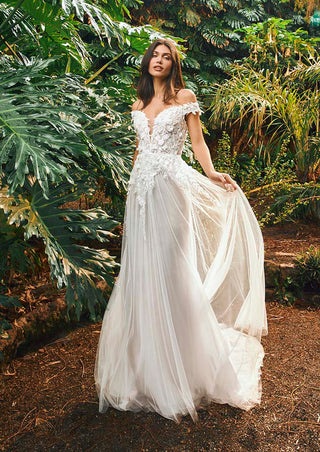 Elegant wedding dress with sheer tulle and luxurious lace accents.