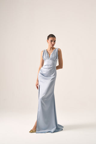 Front view of the Lola Ruched Bodice Gown by Nadia's, featuring the plunging V-neckline, wide shoulder straps, and a graceful full-length skirt.