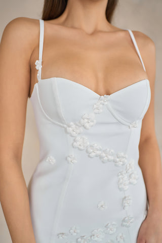 Sophisticated sheath mini dress with floral embellishments, a tailored fit, and a timeless sweetheart neckline design.