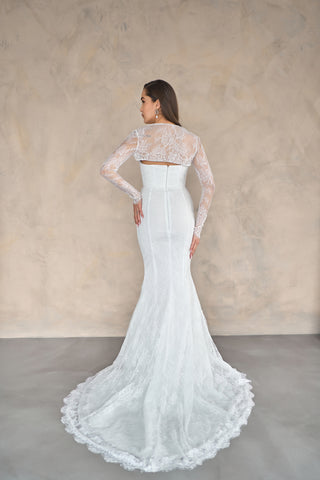 Mermaid wedding dress with a structured sweetheart neckline, delicate lace detailing, and a timeless flared train.